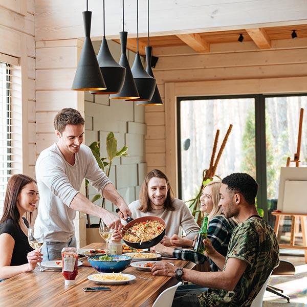 Fashionable young people eating in a stylish kitchen