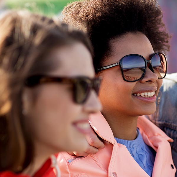 Fashionable young women wearing sunglasses